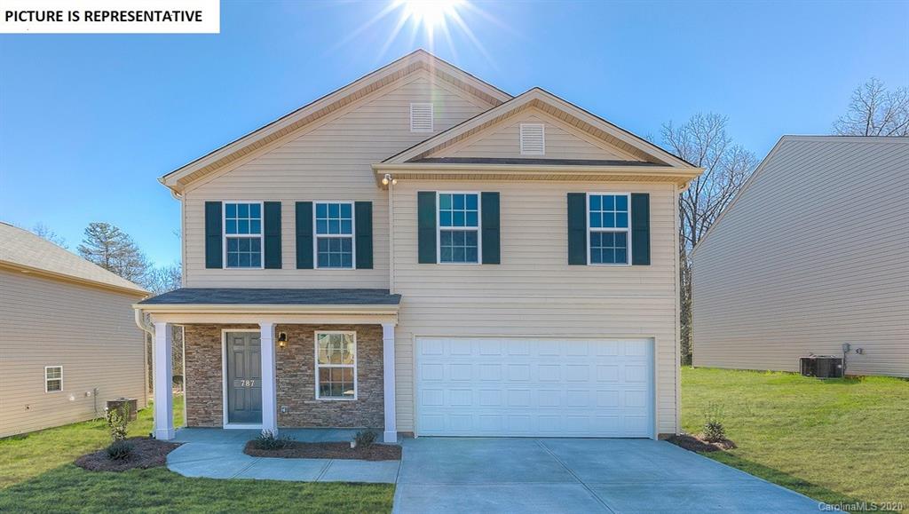 710 Xander Drive, Unit 45 Charlotte, NC 28214 - Photo 1 of 18 a front view of a house with a yard