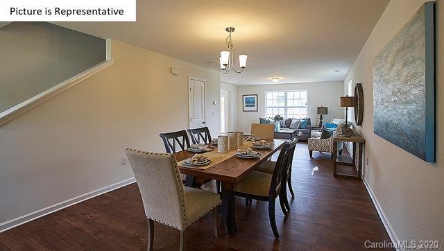 710 Xander Drive, Unit 45 Charlotte, NC 28214 - Photo 2 of 18 a view of a dining room with furniture and wooden floor