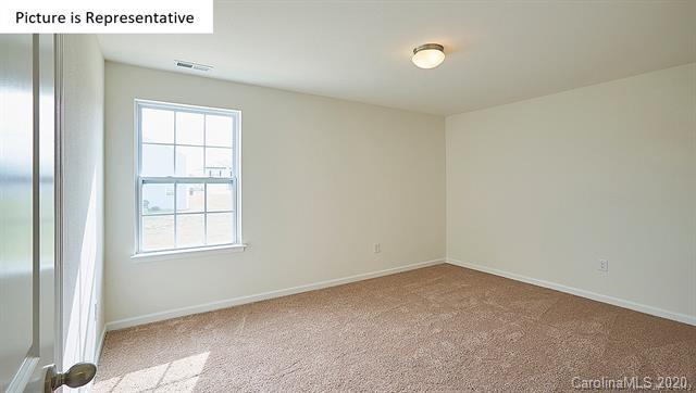 710 Xander Drive, Unit 45 Charlotte, NC 28214 - Photo 18 of 18 an empty room with windows