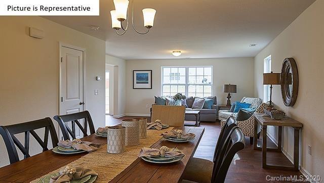 710 Xander Drive, Unit 45 Charlotte, NC 28214 - Photo 3 of 18 a living room with furniture a rug and a window