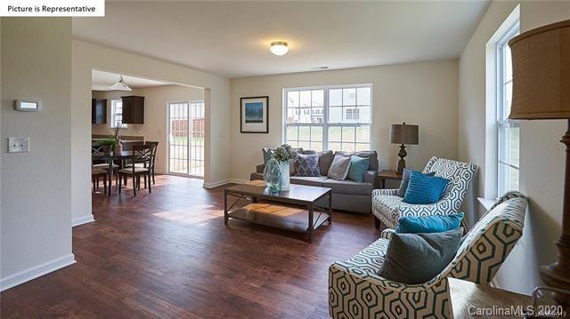 710 Xander Drive, Unit 45 Charlotte, NC 28214 - Photo 5 of 18 a living room with furniture or couch and a wooden floor
