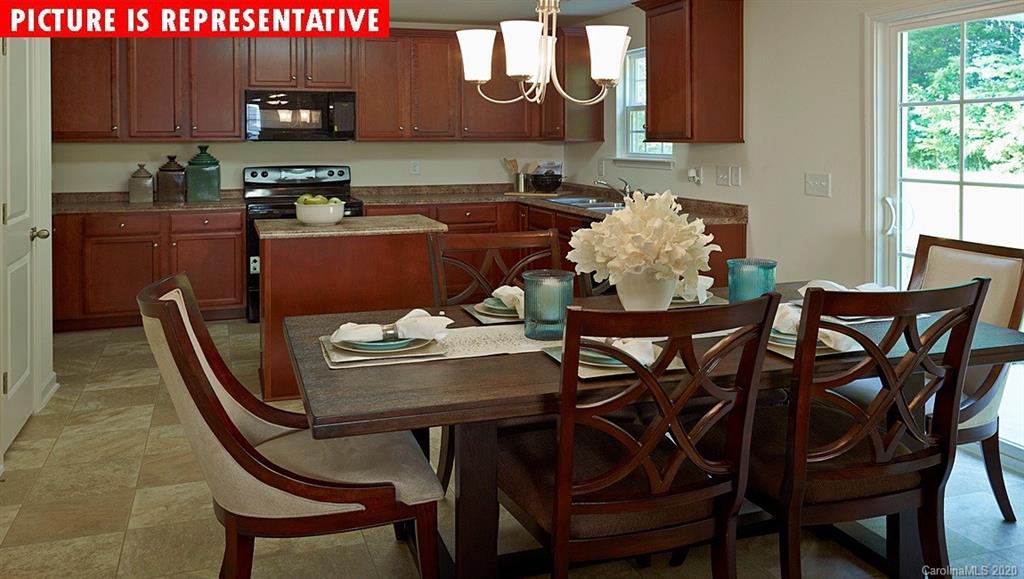 710 Xander Drive, Unit 45 Charlotte, NC 28214 - Photo 6 of 18 a dining room with furniture and window