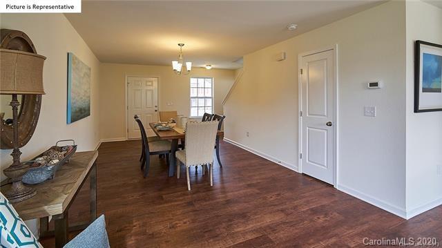 710 Xander Drive, Unit 45 Charlotte, NC 28214 - Photo 9 of 18 a view of a dining room with furniture and wooden floor