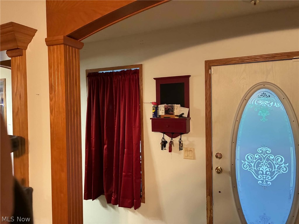 4601 Bessemer Road Nelsonville, OH 45764 - Photo 5 of 25 Entry door with decorative oval glass insert and wood-finish trim
