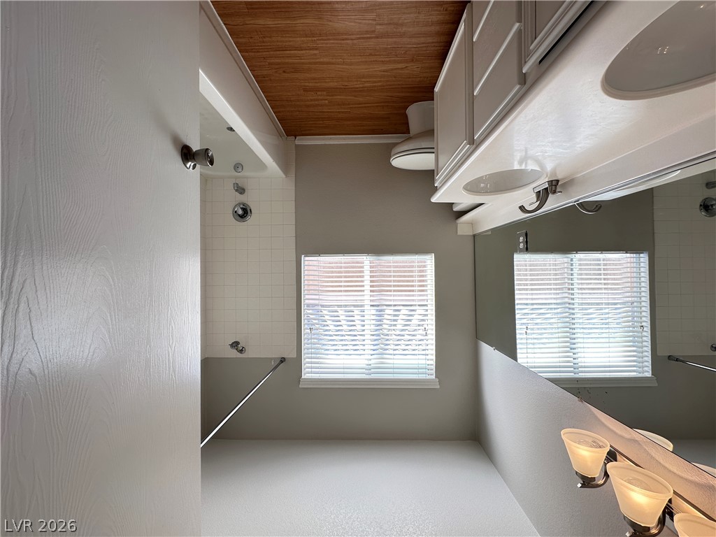 10191 Splendor Ridge Avenue Las Vegas, NV 89135 - Photo 20 of 31 Double vanity and a tiled shower create a functional and pleasant bathroom environment.