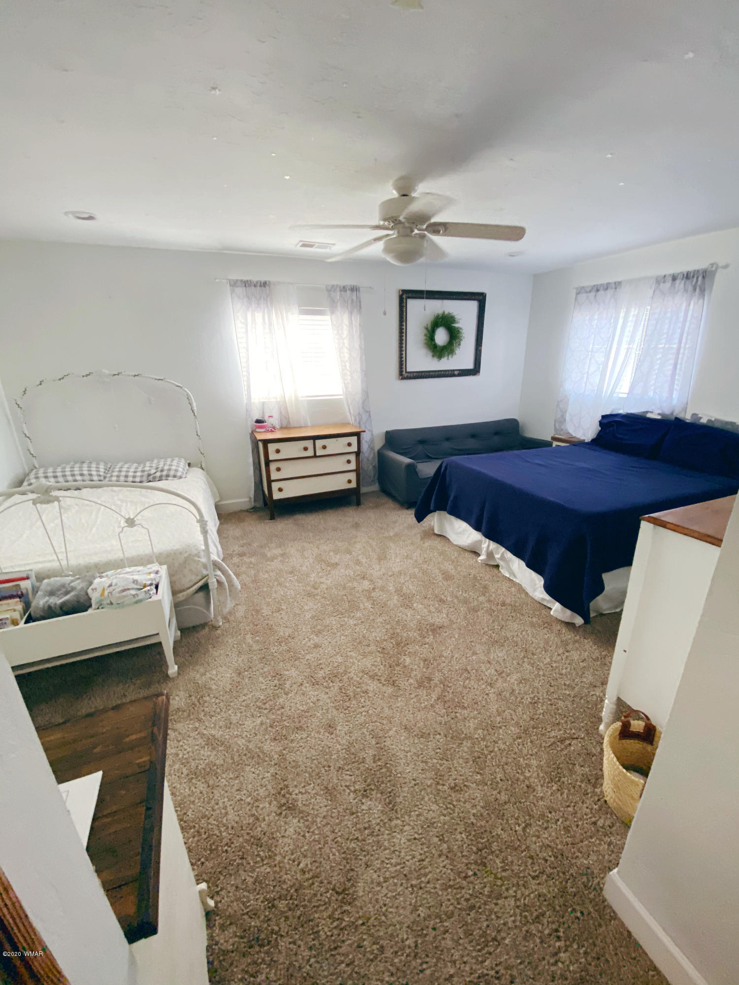 241 West Center Street Snowflake, AZ 85937 - Photo 15 of 25 a spacious bedroom with a bed and a window