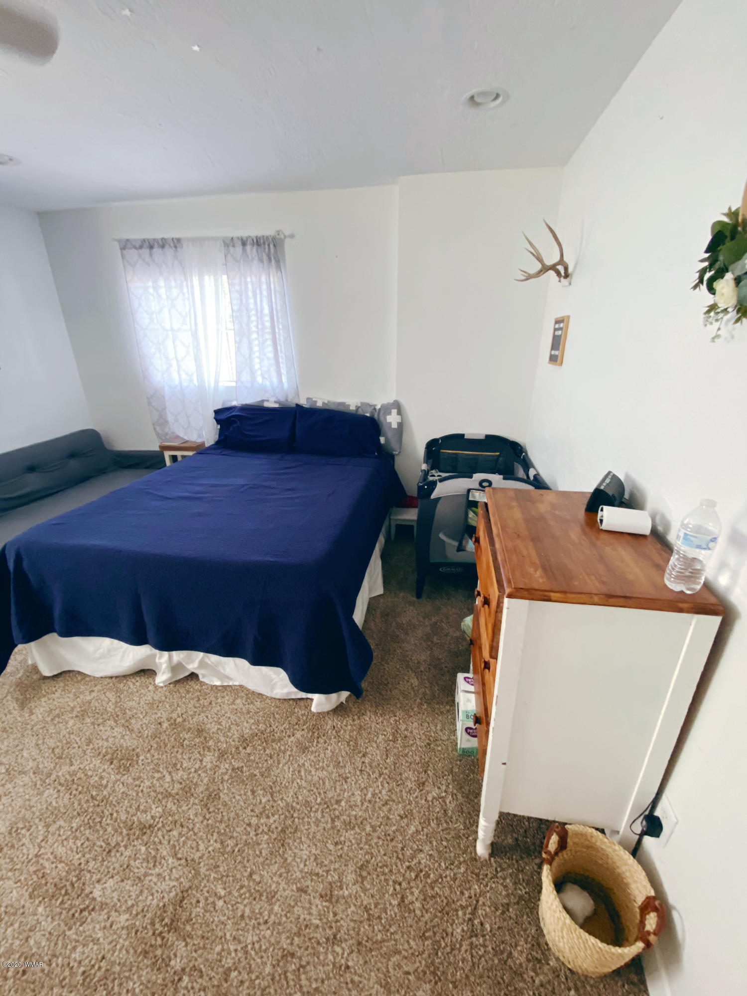 241 West Center Street Snowflake, AZ 85937 - Photo 16 of 25 a bedroom with a bed and window