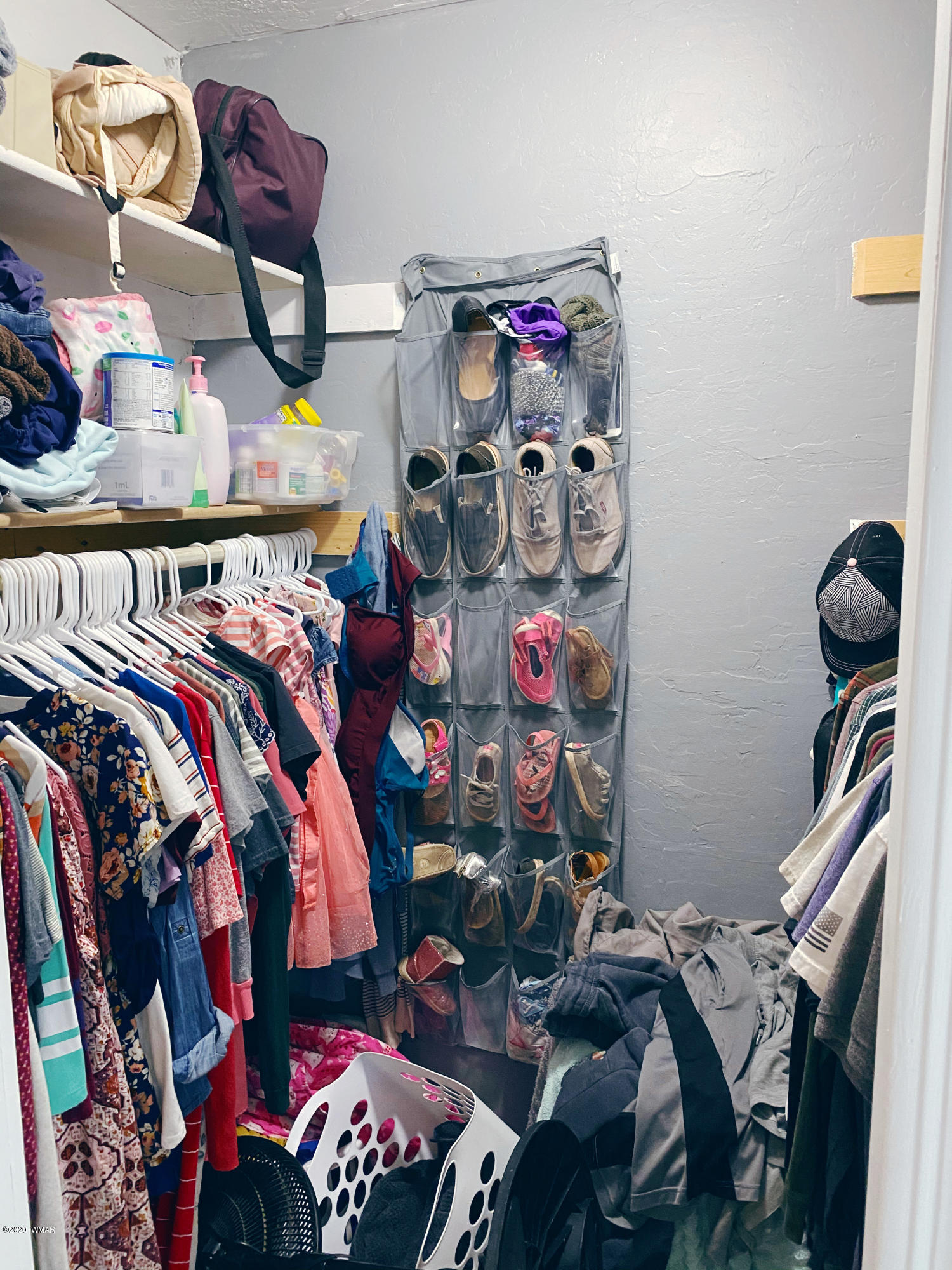241 West Center Street Snowflake, AZ 85937 - Photo 17 of 25 a view of walk in closet with clothes and shoes