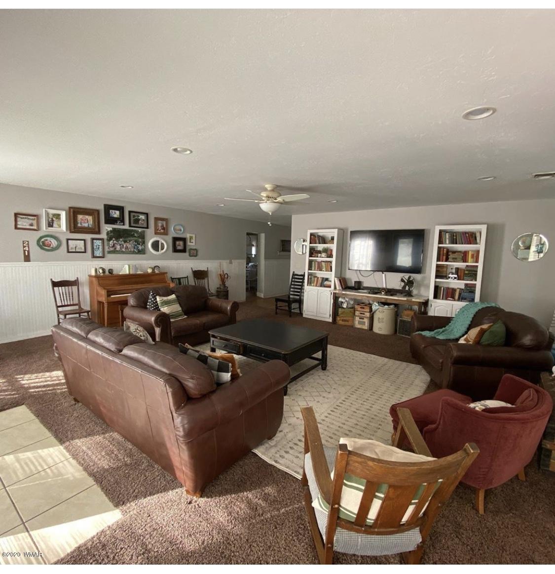 241 West Center Street Snowflake, AZ 85937 - Photo 9 of 25 a living room with furniture kitchen view and a flat screen tv