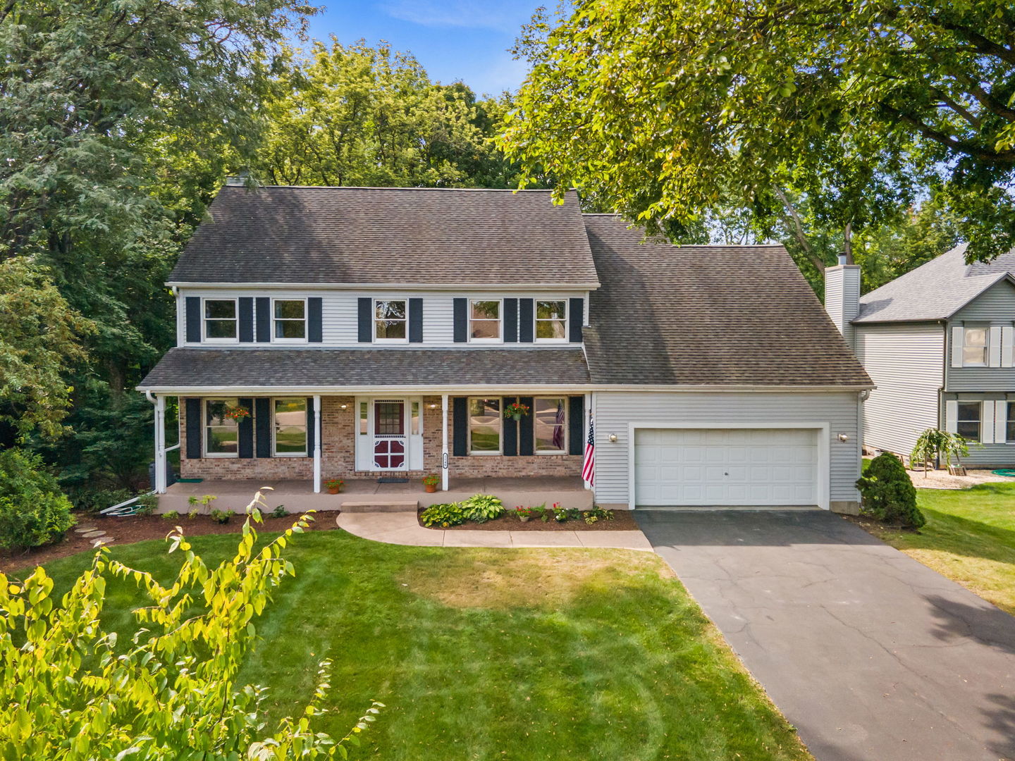 front view of a house with a yard