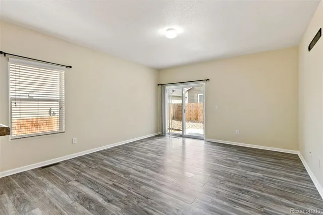 a view of a kitchen with microwave and cabinets