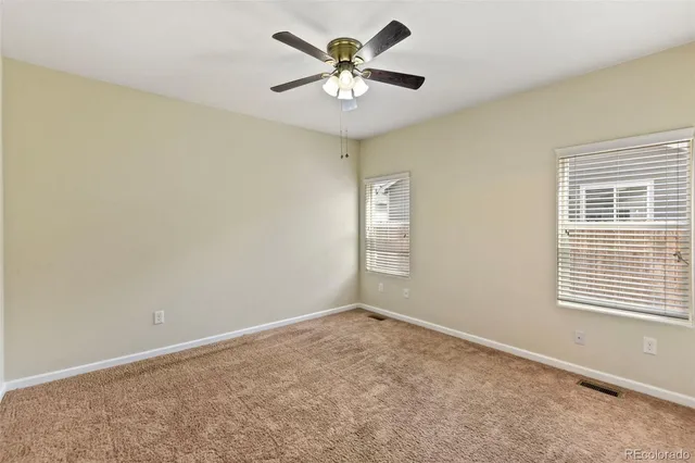 a white bath tub sitting next to a shower