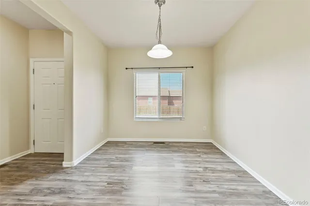 a kitchen with a sink stove and refrigerator