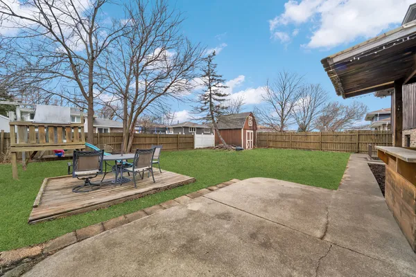 a view of a patio with a yard
