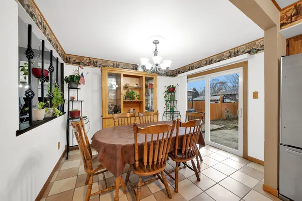 a view of a dining room with furniture window and outside view