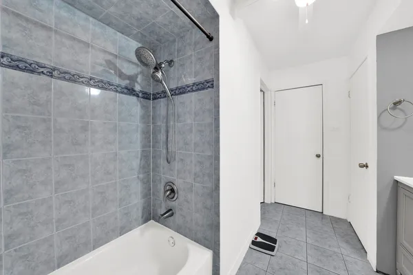 a bathroom with a shower and a toilet