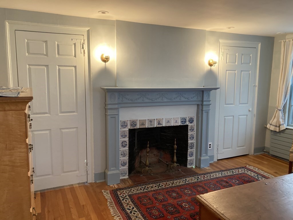 55 Park Street Boston, MA 02129 - Photo 12 of 24 a living room with a fireplace
