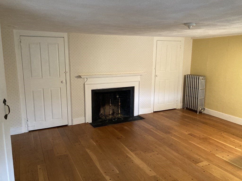 55 Park Street Boston, MA 02129 - Photo 19 of 24 a view of empty room with a fireplace