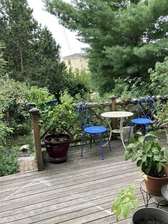 55 Park Street Boston, MA 02129 - Photo 20 of 24 a view of a table and chairs in back yard of the house