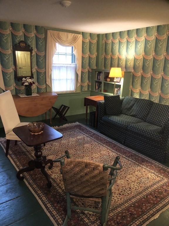 55 Park Street Boston, MA 02129 - Photo 5 of 24 a living room with furniture and a flat screen tv