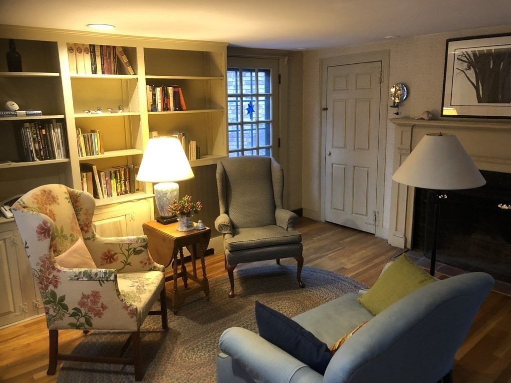 55 Park Street Boston, MA 02129 - Photo 9 of 24 a living room with furniture a lamp and a window