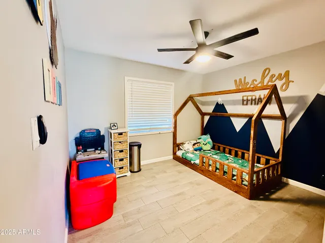 a bedroom with furniture and workout equipment
