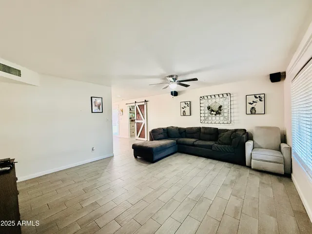 a living room with furniture and a couch