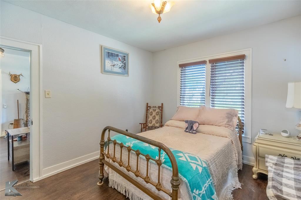 202 East Ross Street Rising Star, TX 76471 - Photo 27 of 40 a bedroom with a bed and a window