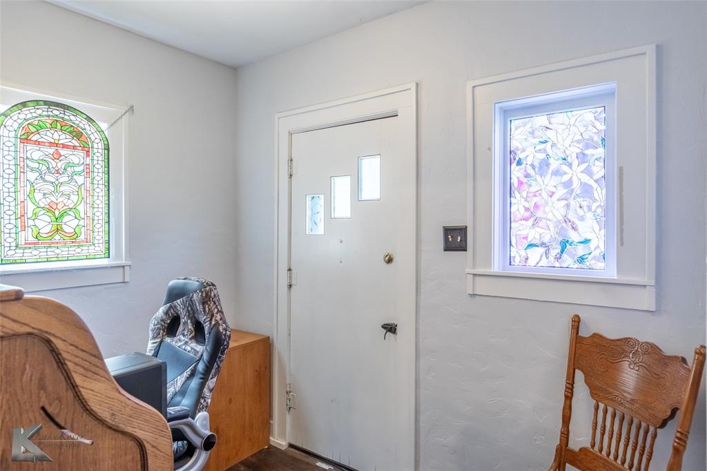 202 East Ross Street Rising Star, TX 76471 - Photo 28 of 40 a view of a workspace with furniture and a window