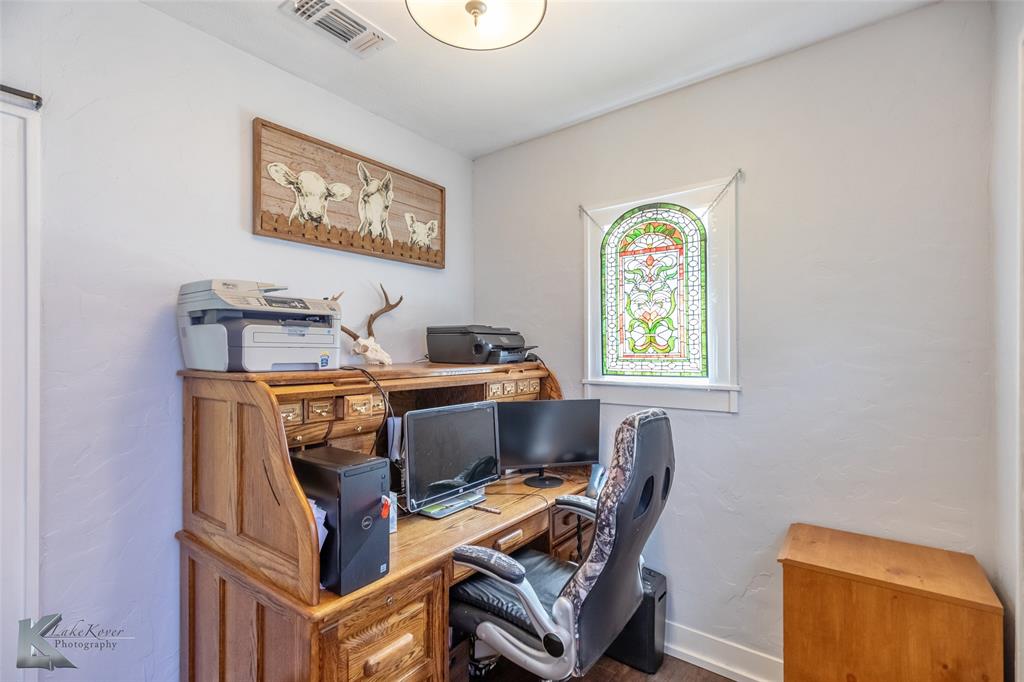 202 East Ross Street Rising Star, TX 76471 - Photo 29 of 40 a workspace with furniture and window