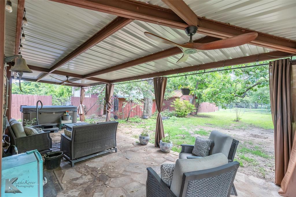 202 East Ross Street Rising Star, TX 76471 - Photo 31 of 40 a view of a patio with a table chairs and backyard