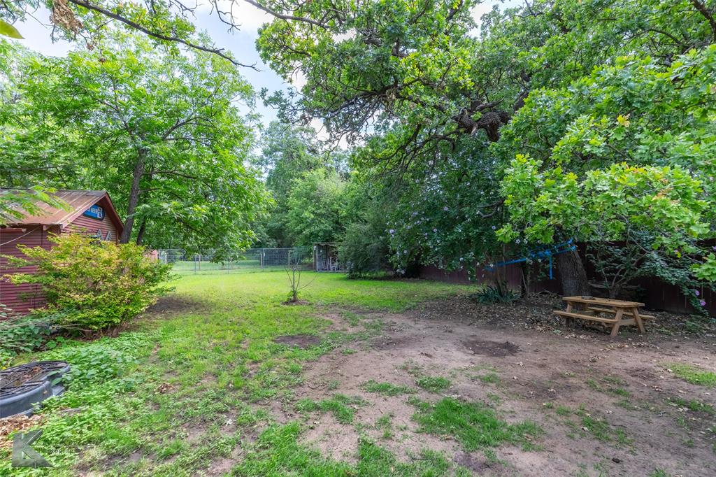 202 East Ross Street Rising Star, TX 76471 - Photo 33 of 40 a view of backyard with outdoor seating and green space