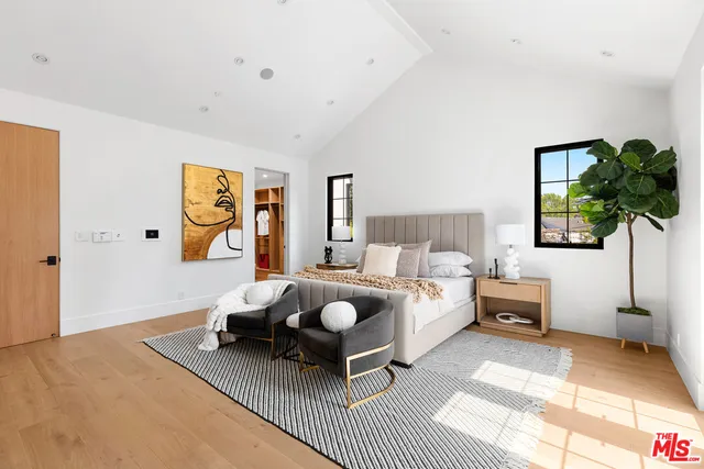 a bedroom with a bed and a fireplace