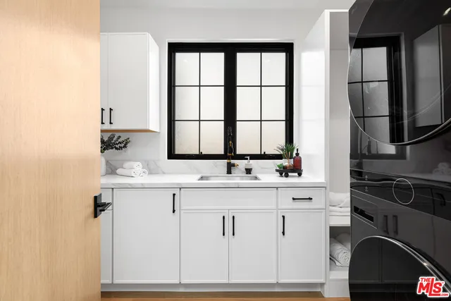 a bedroom with two beds and a window