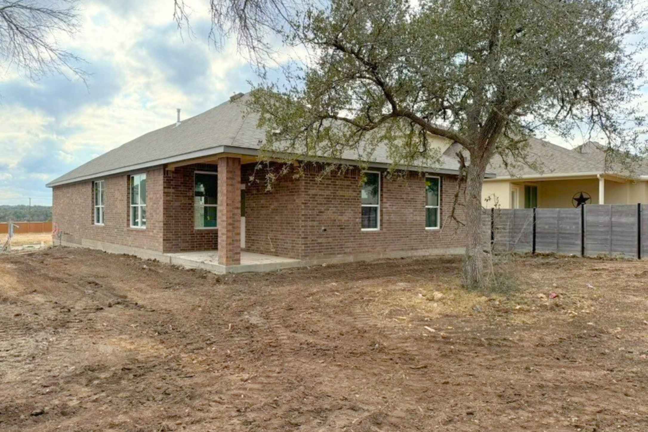 410 Raleigh Drive Georgetown, TX 78633 - Photo 7 of 40 View of property exterior with a patio and brick siding