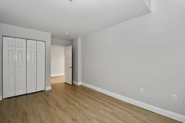 a view of wooden floor and entryway