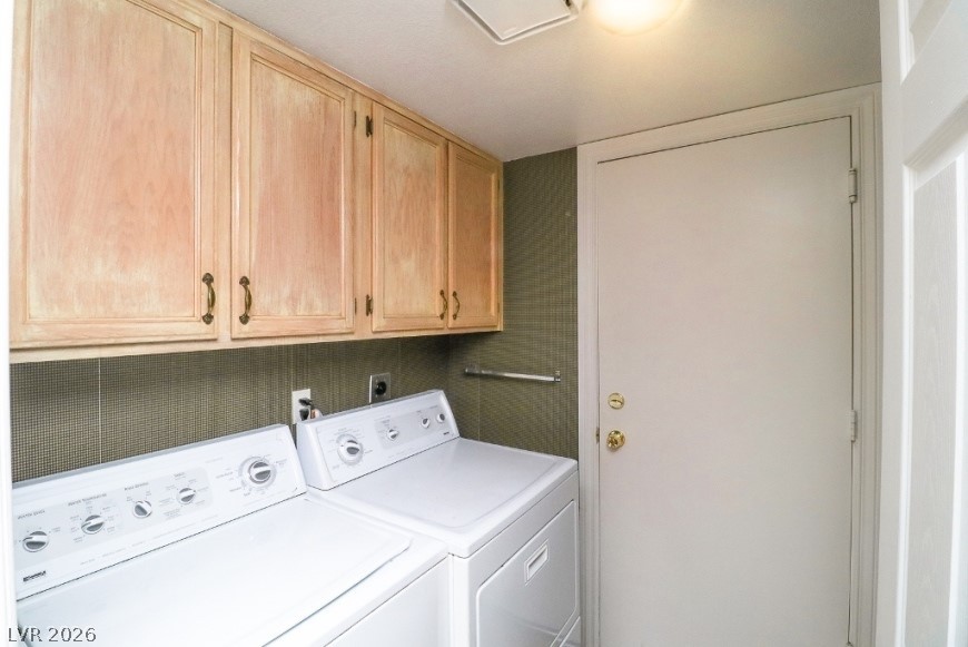 1429 Hawkwood Road Henderson, NV 89014 - Photo 16 of 53 Functional workspace features built-in upper cabinetry and dedicated washer and dryer installations.