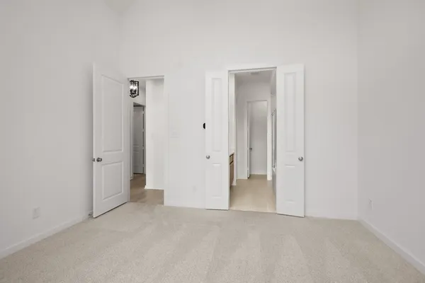 a living room with furniture and painting on the wall