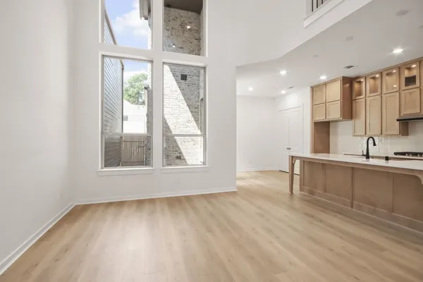 a kitchen with stainless steel appliances granite countertop a sink and cabinets