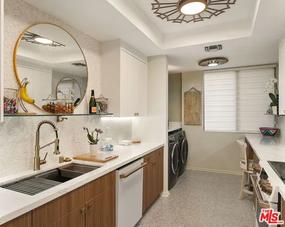 a en suite bathroom with a double vanity sink and a mirror