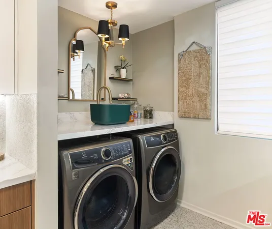 a view of living room with washer and dryer