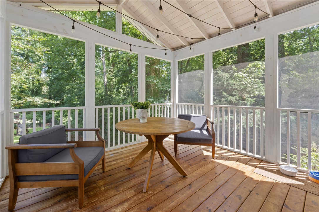 203 Augusta Road Clemson, SC 29631 - Photo 11 of 31 A tranquil screened porch, perfect for enjoying the verdant outdoor scenery.