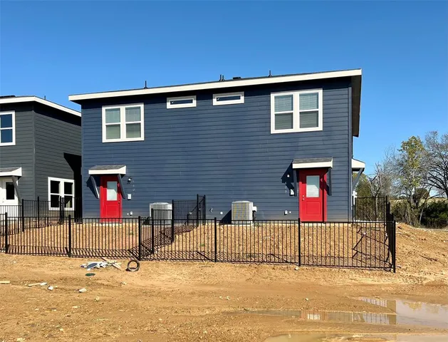 a front view of a house with a street