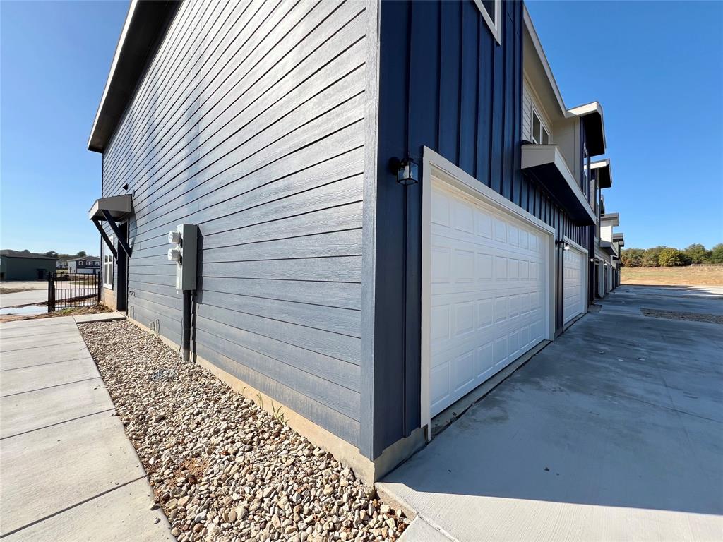 3501 East Renfro Street, Unit 408 Burleson, TX 76028 - Photo 2 of 35 a view of a house with backyard and wooden floor