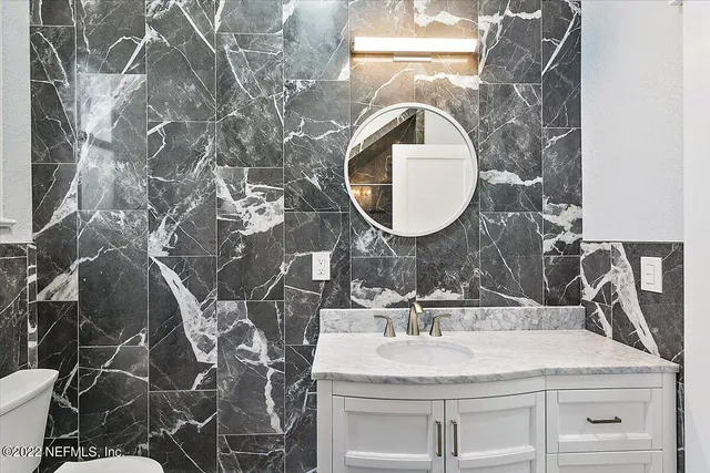 a bathroom with a sink and a mirror