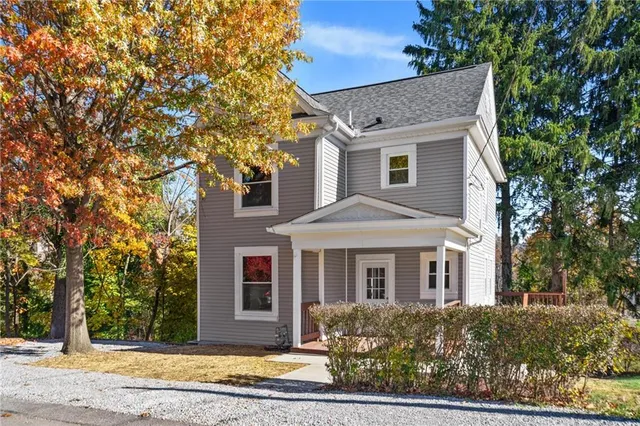 front view of a house with a yard