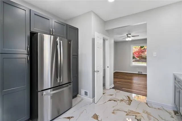 a bathroom with a shower and a sink