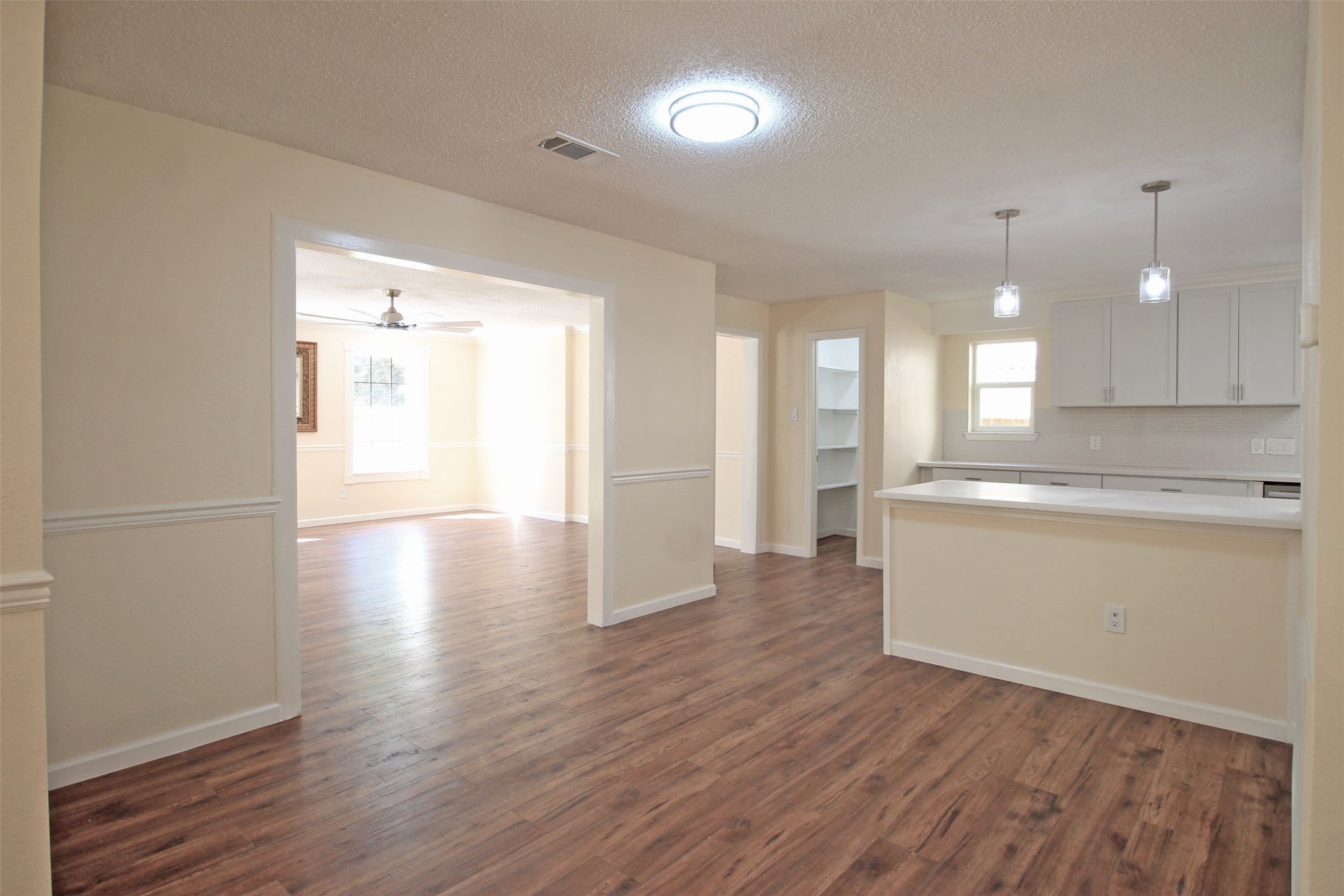 8011 Goldengrove Drive Spring, TX 77379 - Photo 11 of 48 a view of a kitchen with wooden floor and a window
