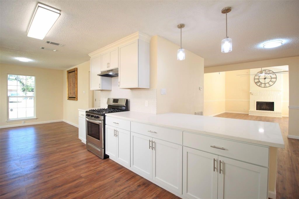 8011 Goldengrove Drive Spring, TX 77379 - Photo 18 of 48 a kitchen with white cabinets and sink