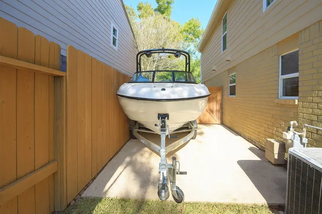 a view of a kitchen with wooden floor and a window